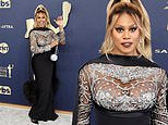 Laverne Cox cuts a fashionable figure in sheer top and a long skirt as she arrives at the SAG Awards