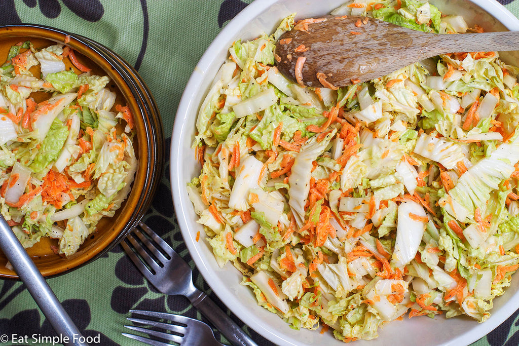 This basic cole slaw recipe is made by combining crispy cabbage and carrots with a wee bit of sugar, mayo, and apple cider vinegar and letting it sit to allow the flavors to combine. 