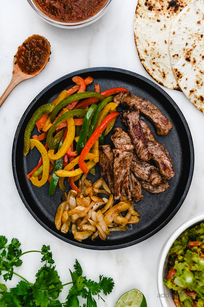 Ribeye Steak Fajitas are so quick, easy and flavorful! Made with perfectly seasoned, tender Ribeye steak, bell peppers and onions, they are always a favorite!